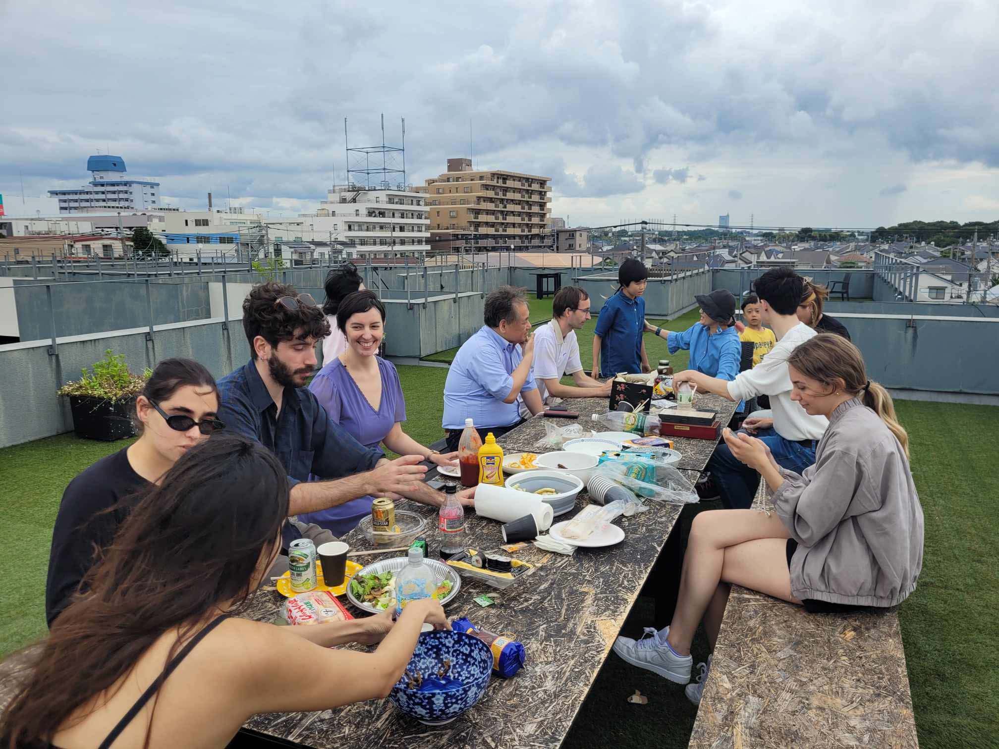Rooftop BBQ party with residents gathering